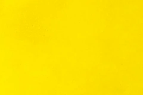 Bright vibrant yellow textured background with subtle grain, offering blank.. Stock Illustration