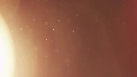 Bright warm light leak glows over floating dust particles Stock Footage 329598546