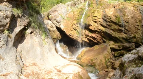 Bright waterfall cascades with cave Stock-Footage 8623678