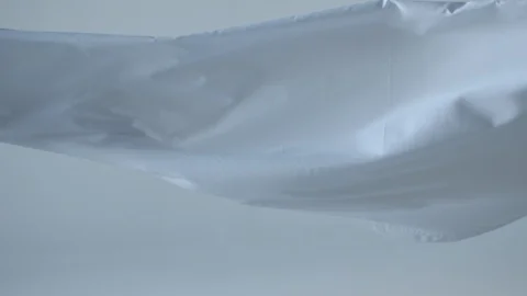 Bright white cloth moving in super slow motion at 240fps Stock Footage 87766176