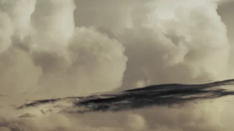 Bright White Cloud Above Dark Storm Cloud at Sunset Stock Footage 341652550