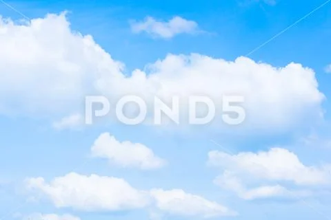 Bright white clouds and light blue sky in spring season. Stock Photos