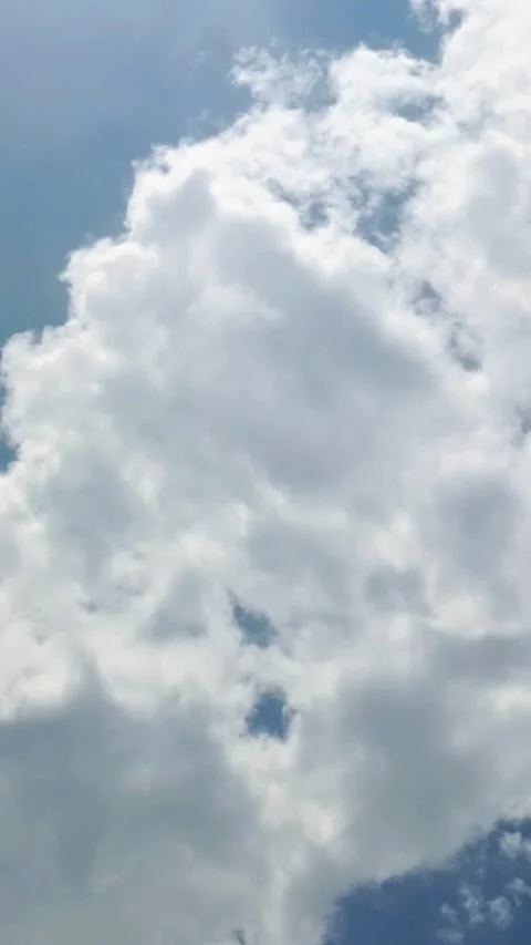 Bright white clouds fly across the bright blue sky. The sky is clear in the.. Stock Footage 295639036