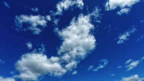 Bright White Clouds Moving Across Deep Blue Summer Sky 스톡 동영상 335074533