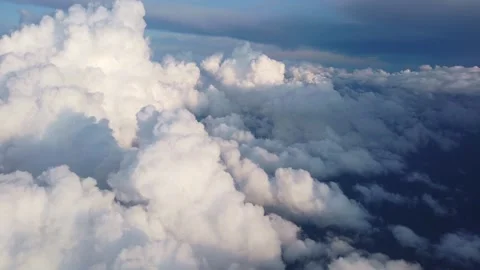 Bright white cumulus clouds forming patterns viewed from high-altitude aircraft Stock-Footage 342132170