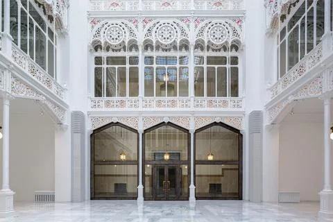 Bright white empty library hallway with skylight and lights hanging in corr.. Fotos de archivo