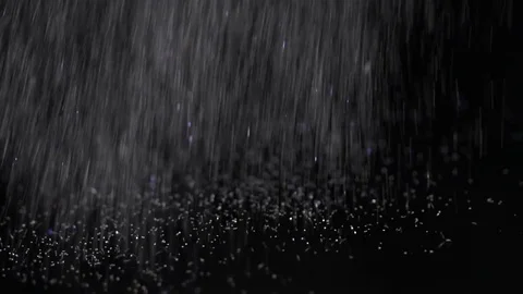 Bright white glitter falling on the black background, abstract slow motion Stock Footage 75969313