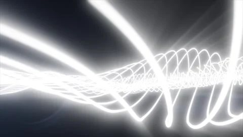 Bright white glowing waveform lines crossing a dark background, suggesting .. Stock Footage 337875684