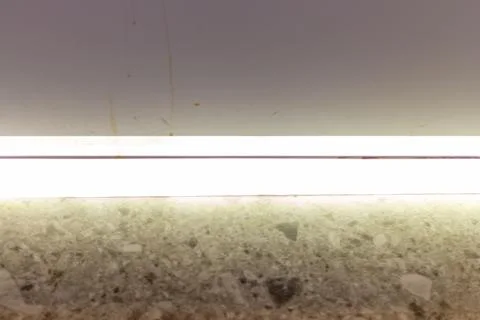 Bright white led strip light under kitchen cabinet on granite countertop Stock Photos