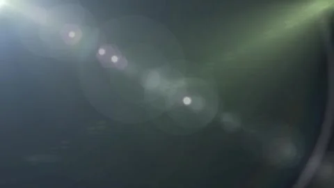 Bright white lens flare effect with light streaks on a dark black background Stock Footage 346199647