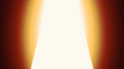 Bright white light flooding through a doorway in the darkness. 4K Video stock 345111578