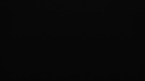 Bright white lightning bolt striking straight down on a dark background Vídeo Stock 344720116