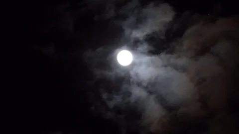 Bright white moon between volume cumulus clouds. Werewolves time. Stock Footage 108023923