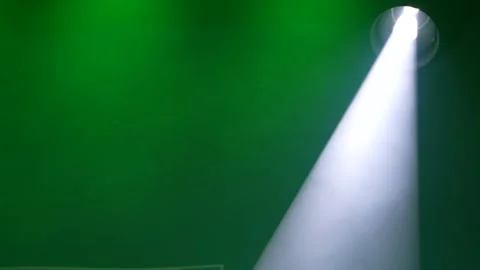 Bright white stage spotlight beam through thick green smoke Stock Footage 346358802