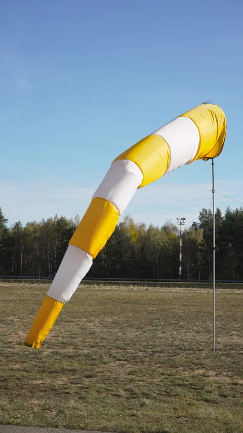 Bright windsock waving in wind, vertical video. Stock Footage 343953487