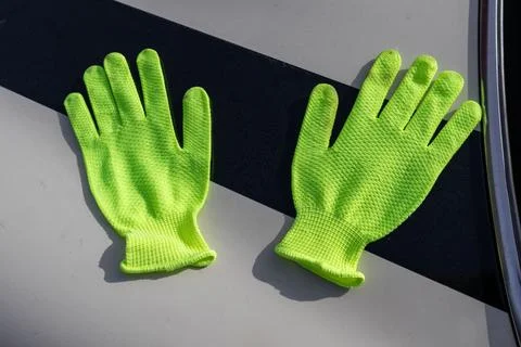 Bright Work Gloves Placed on a Flat Surface in a Work Environment During Da.. Stock Photos