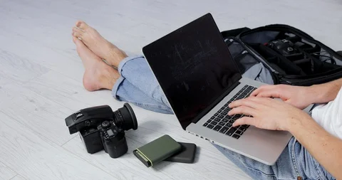 Bright work space in a cozy, light studio. Freelancer Photographer film camera Stock Footage 127703356