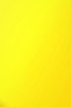 A bright yellow abstract gradient gently shifts toward golden tones along t.. Stock Illustration