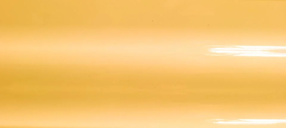 Bright yellow background with light Stockfoto's
