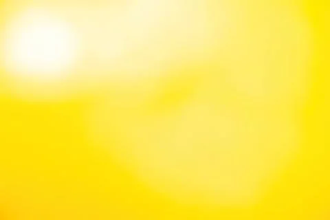 Bright yellow background with soft glow and gradient Stock Photos