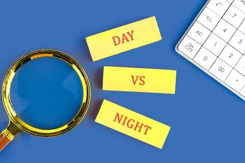Bright yellow blocks display the contrast of day and night, set against a vib Stock Photos