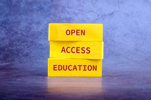 Bright yellow blocks display the text open access education against a texture Stock Photos