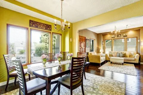 Bright yellow dining room Stock Photos