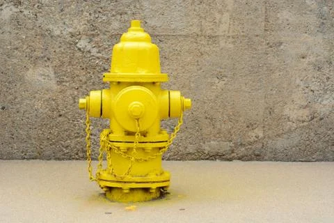 Bright yellow fire hydrant Stock Photos