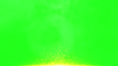 Bright yellow fire sparks rising upwards against a vibrant neon green chroma Stock Footage 346037169