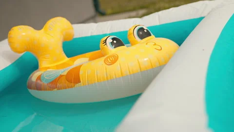 Bright Yellow Floatable Pool Toy for Kids, Handheld Shot Video stock 281268837