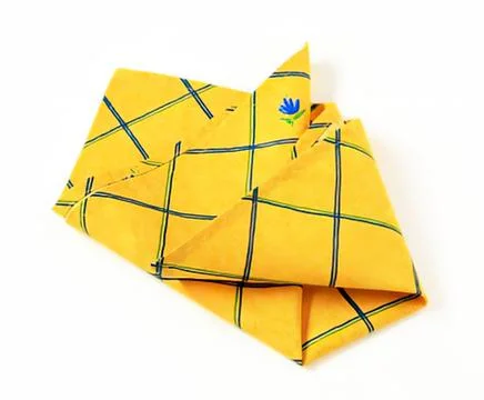Bright yellow folded cloth with grid pattern Stock Photos
