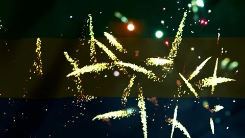 Bright yellow gold fireworks exploding against the national flag of Gabon Video stock 343691003