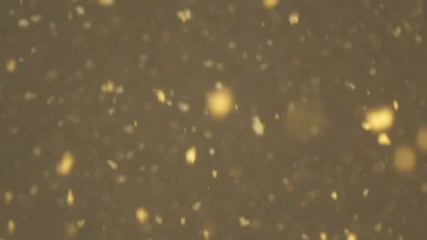 Bright Yellow Gold Particles Flow Through The Liquid Stock Footage 266800235