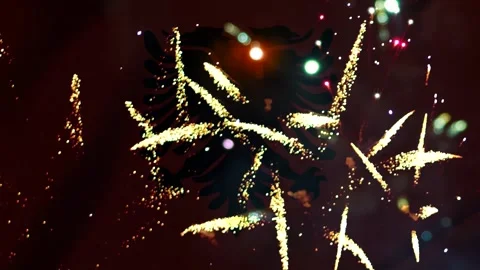 Bright yellow golden fireworks exploding in the night sky over the albanian.. Video stock 343691008