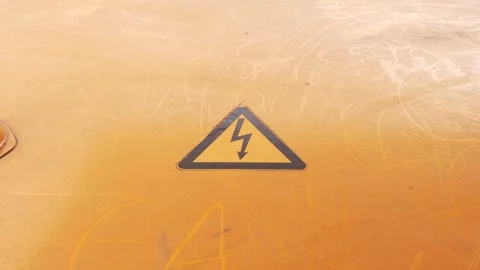 Bright yellow High Voltage warning sign, electicity danger attention label Stock Footage 274909168