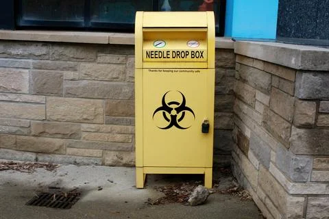Bright Yellow Needle Drop Box for Safe Disposal Stock Photos
