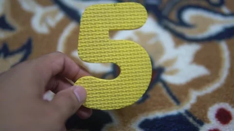 A bright yellow number five Video stock 300426921