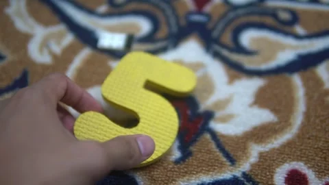 A bright yellow number five Stock Footage 300426923