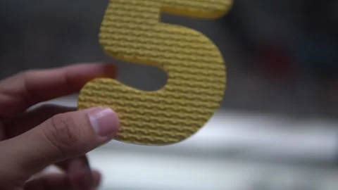 A bright yellow number five Stock Footage 300426939