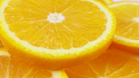 Bright yellow orange slices rotation close up Stock Footage 240925853