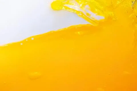 Bright yellow paint splash on light background Foto stock