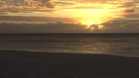 Bright yellow sun in sky over ocean Stock Footage 74062584
