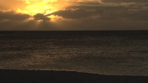 Bright yellow sun in sky over ocean Stock Footage 74062585
