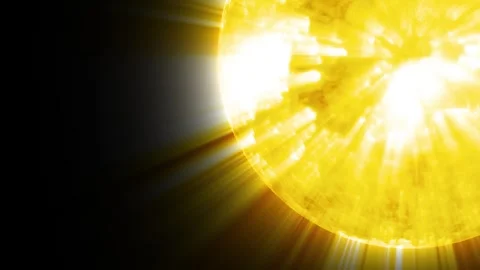 Bright yellow sun with strong light rays and flare against a dark background Stock Footage 337080274