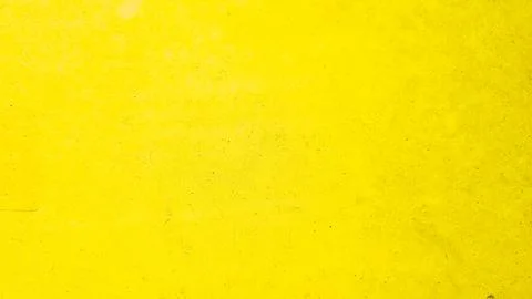 Bright yellow textured background with subtle imperfections, ideal for mode.. 스톡 사진