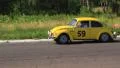 Bright yellow Volkswagen Beetle following Citroen 11B in racing of vintage cars HD Footage