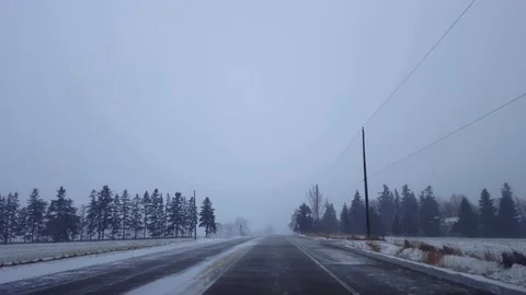 *Brighter Version* Driving Winter Snow Storm on Rural Road in Day Stock Footage 123386259