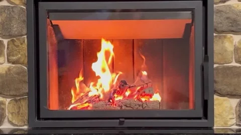 Brightly burning fireplace inside the house Stock Footage 261806677