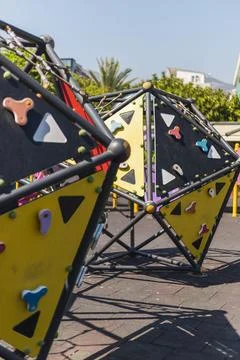 Brightly colored climbing structures invite children to engage in active play Stock Photos