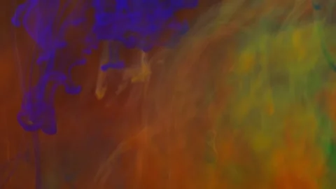 Brightly colored clouds of smoke dance. Hues of yellow, blue, green and red dark Video stock 247781760